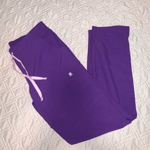 Figs purple scrub pants.
